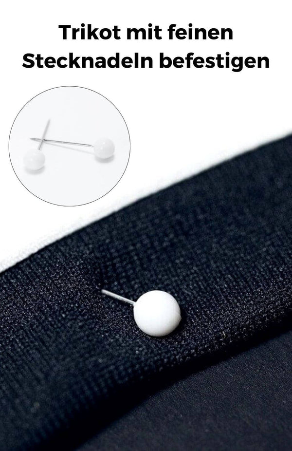Trikot mit Stecknadeln im Trikotrahmen befestigen